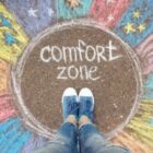 Comfort zone concept. Feet standing inside comfort zone circle.